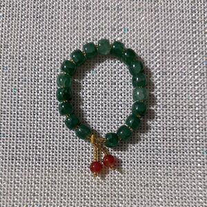 Handmade Green Jade Stretch Bracelet with Small Rust Tasseled Design